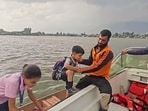 The State Disaster Response Force (SDRF) rescues stranded children amid a sudden storm at Dal Lake, in Srinagar on Tuesday. (SDRF/ANI)