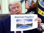 U.S. President Donald Trump holds a reflecting pool image at the Oval Office of the White House, in Washington, D.C., June 3, 2026.