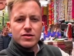 The viral clip captures a touching moment between a traveller and a local shopkeeper.