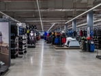 A man was seen playing cricket inside a Decathlon store.