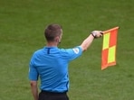 Linesman signalling offside.
