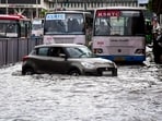 Vehicles wade through a waterlogged road after rainfall, in Thiruvananthapuram, Kerala, Saturday, May 30.