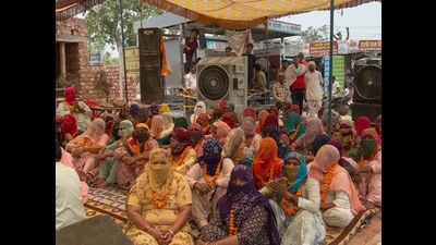 A day after Hansi police registered two FIRs against 31 residents of Chaint village for allegedly disrupting work on an under-construction pipeline and blocking the Hansi-Barwala road during a protest over drinking water supply pipeline, 51 women from the village observed a one-day hunger strike at the protest site on Wednesday. (HT Photo)