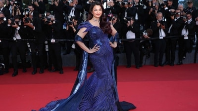Aishwarya Rai walked the red carpet at the 79th Cannes Film Festival in a sculpted Amit Aggarwal gown, completed with a flowing dupatta-style drape. (AFP) Aishwarya Rai walked the red carpet at the 79th Cannes Film Festival in a sculpted Amit Aggarwal gown, completed with a flowing dupatta-style drape. (AFP)