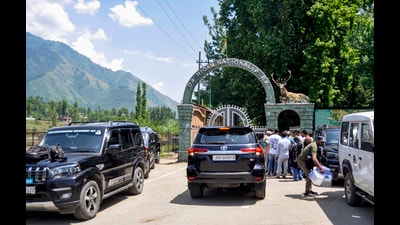 Vehicles carrying Jammu and Kashmir legislators MLAs and MPs arrive for a meeting in Srinagar on Wednesday. (PTI) Vehicles carrying Jammu and Kashmir legislators MLAs and MPs arrive for a meeting in Srinagar on Wednesday. (PTI)