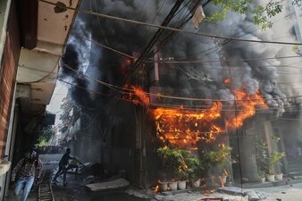Local people attempt to douse a fire at a hotel in New Delhi, India, Wednesday, June 3, 2026. (AP) Local people attempt to douse a fire at a hotel in New Delhi, India, Wednesday, June 3, 2026. (AP)