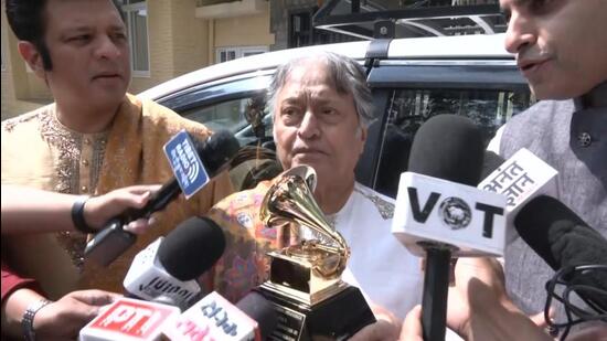 Sarod maestro Amjad Ali Khan and his sons, Amaan Ali Bangash and Ayaan Ali Bangash, at Dharamshala on Wednesday to present the Grammy Award they won with the Tibetan spiritual leader for Meditations: The Reflections of His Holiness the Dalai Lama. (ANI Photo)
