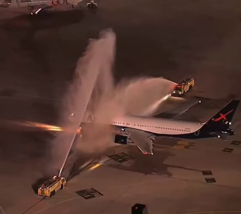 The plane that received a ceremonial water salute The plane that received a ceremonial water salute
