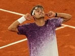 Italy's Flavio Cobolli reacts after winning the quarterfinal tennis match against Canada's Felix Auger-Aliassime at the French Open in Paris