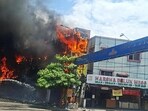 Dark smoke and flames billow out after a fire breaks out on the second floor of the KSR Shopping Complex near Metro Pillar No. 1043 at Ameerpet, in Hyderabad on Thursday. (ANI)