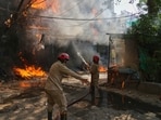 Firefighters douse a fire in a hotel in Delhi's Malviya Nagar on Wednesday.