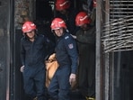 Firefighters and local residents rescue people from a building and shift them to nearby hospitals after a massive fire broke out at a bed-and-breakfast Restaurant and Hotel in the Malviya Nagar area in New Delhi, India, on Wednesday, June 3, 2026. 
