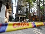 Delhi police barricade the fire spot where fire broke out yesterday morning, at Hauz Rani in New Delhi.