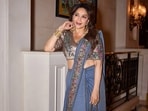 Madhuri Dixit looks stunning in a denim saree. 