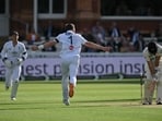 England's Ollie Robinson celebrates taking the wicket of New Zealand's Daryl Mitchell.