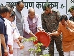 Defence minister Rajnath Singh planting a sapling in Lucknow on the occasion of World Environment Day. (HT photo)
