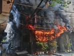 Locals attempt to douse a fire at a hotel in New Delhi, India, Wednesday, June 3, 2026. (AP Photo/Manish Swarup) (AP)