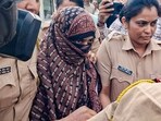 Police personnel escort Nida Khan, the prime accused in the TCS Nashik case involving alleged sexual harassment and forced religious conversions, at the Additional Sessions Court in Nashik Road, Friday, May 8, 2026. Khan was remanded to police custody till May 11.
