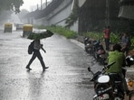 Commuters make their way through rain during a sudden spell of showers at ITO in New Delhi, India, on Thursday, June 4, 2026. 