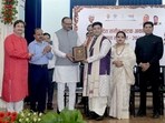 UP dy chief minister Brajesh Pathak honouring an artiste in Lucknow on Friday (HT Photo)