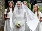 Harriet Sperling arrives for her wedding with Princess Anne's son Peter Phillips, accompanied by the bridesmaids, her daughter Georgina and Peter Phillips' daughters Savannah and Isla, at All Saints' Church in Kemble, Cirencester, Britain.