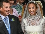 A photographer takes pictures as Princess Anne's son Peter Phillips and Harriet Sperling leave following their wedding at All Saints' Church in Kemble, Cirencester, Britain, June 6, 2026. REUTERS/Dylan Martinez