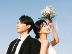 Musical theatre stars Lee Jun Woo and Baek Eun Hye during their wedding photoshoot. 
