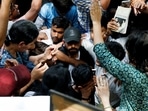 Abhijeet Dipke, head of the Cockroach Janta Party (CJP), joins supporters of the CJP during a sit-in protest demanding the resignation of Education Minister Dharmendra Pradhan.