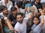Cockroach Janta Party (CJP) founder Abhijeet Dipke holds a copy of the autobiography of Dr BR Ambedkar during a protest at the Jantar Mantar, in New Delhi.