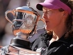 Russia's Mirra Andreeva kisses the trophy after winning the French Open on Saturday. (AFP)