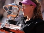 Mirra Andreeva kisses the trophy after winning the 2026 French Open women’s singles final in Paris on June 6, 2026.
