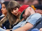 Travis Kelce (R) of the Kansas City Chiefs reacts as Singer Taylor Swift looks on during the fourth quarter in Game Three in the NBA Eastern Conference Finals at Rocket Arena on May 23, 2026 in Cleveland, Ohio.