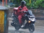 Thane, India – May 07, 2025: Due to heavy rains in city, waterlogging occurred on the road at Majiwada Junction, and commuters along with vehicles are seen making their way through the water, in Thane, in Mumbai, India, on, Saturday, May 07, 2025. (Praful Gangurde / Hindustan Times)