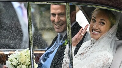 Harriet Sperling waves from a vehicle as she sits with Peter Phillips, on the day of their wedding at All Saints' Church in Kemble, Cirencester, Britain, June 6, 2026. REUTERS/Dylan Martinez (REUTERS)