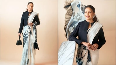 In another look, Madhuri showed how to give the classic saree a contemporary twist. She paired a white saree featuring black floral prints with a matching black full-sleeved jacket. (Instagram/@madhuridixitnene) In another look, Madhuri showed how to give the classic saree a contemporary twist. She paired a white saree featuring black floral prints with a matching black full-sleeved jacket. (Instagram/@madhuridixitnene)