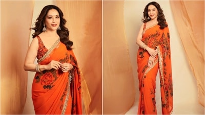 If you're looking for festive fashion inspiration, bookmark Madhuri's orange saree featuring digital floral prints and striking golden borders. (Instagram/@madhuridixitnene) If you're looking for festive fashion inspiration, bookmark Madhuri's orange saree featuring digital floral prints and striking golden borders. (Instagram/@madhuridixitnene)