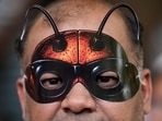 A Cockroach Janta Party (CJP) supporter wears a cockroach-themed mask during a protest demanding the resignation of Union Education Minister Dharmendra Pradhan on June 6, 2026. A Cockroach Janta Party (CJP) supporter wears a cockroach-themed mask during a protest demanding the resignation of Union Education Minister Dharmendra Pradhan on June 6, 2026.