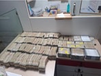 The cash and multiple properties linked to the accused were found during simultaneous raids conducted by Odisha's Vigilance department on Saturday.