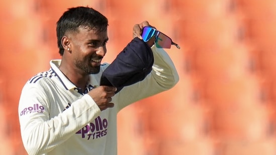 India's Manas Suthar, right, celebrates after taking the wicket of Afghanistans's Afsar Zazai on day two of a Test cricket match between India and Afghanistan, (PTI)