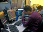A share broker reacts as Sensex and Nifty prices plummet in Kolkata.