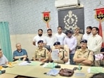 SSP Aligarh Neeraj Kumar Jadaun addressing media at Aligarh on Monday. (HT Photo)