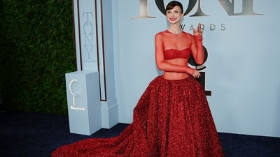 Dylan Mulvaney was a vision in vibrant red as she arrived in a floor-length gown complete with a dramatic sweeping train. The show-stopping ensemble featured a sheer, long-sleeved bodice layered over a sparkling bralette that accentuated her silhouette, before flowing into a voluminous skirt richly embellished with shimmering red sequins and crystals. (REUTERS)