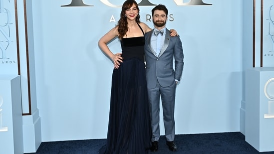 Erin Darke and Daniel Radcliffe turned the awards ceremony into a rare red-carpet date night, stepping out in coordinated looks from Todd Snyder. Erin stunned in a floor-length, flowing gown in shades of black and blue, while Daniel complemented her look in a sophisticated blue-grey tuxedo accented with sleek silver lapels.(AP Photo/Evan Agostini)
