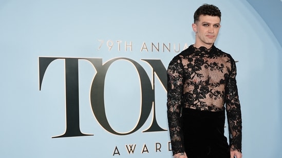 The Rocky Horror Show director Sam Pinkleton attended the Annual Tony Awards in a sheer black lace, full-sleeved top paired with plush black velvet bell bottoms.(REUTERS)