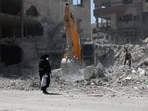 A woman looks at the rubble of her house, which was damaged in a U.S. and Israeli strike in March, in Tehran, Iran June 7, 2026.
