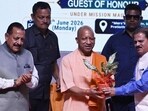 Chief minister Yogi Adityanath, welcomed by Dr. M. Mohapatra, director general of meteorology at IMD, during the formal inauguration of the Regional Meteorological Centre, in Lucknow. (Deepak Gupta/HT)