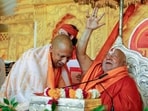 Chief minister Yogi Adityanath meets and seeks blessings from Jagadguru Swami Rambhadracharya during nine days of Ram Katha, in Lucknow on Tuesday. (ANI Photo)