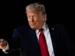 FILE PHOTO: U.S. President Donald Trump reacts as he boards Air Force One, after attending Game 3 of the NBA Finals, at John F. Kennedy International Airport in New York, U.S., June 8, 2026. REUTERS/Nathan Howard/File Photo
