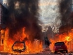 Vehicles set on fire by protesters burn on Lendrick Street in east Belfast, Northern Ireland, on Tuesday, June 9, 2026, after the arrest of a Sudanese man accused of stabbing a man in the northern part of the city.