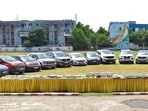 The laptops, phones and cars seized from the accused gang. (HT Photo)